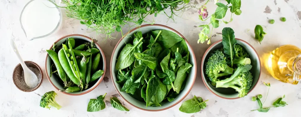 Fresh greens and vegetables on a table